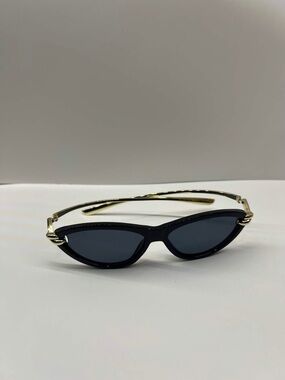 Sleek Black Cat-Eye Sunglasses with Gold Accents